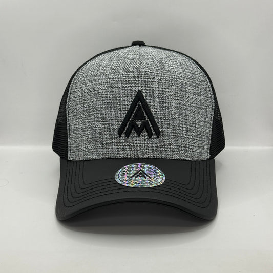 Gorra Trucker AMBULA - Edición "Textura Contraste" (Gris Jaspeado & Visera Símil Cuero Negra)