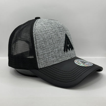 Gorra Trucker AMBULA - Edición "Textura Contraste" (Gris Jaspeado & Visera Símil Cuero Negra)
