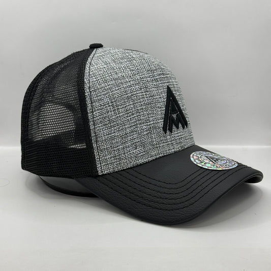 Gorra Trucker AMBULA - Edición "Textura Contraste" (Gris Jaspeado & Visera Símil Cuero Negra)